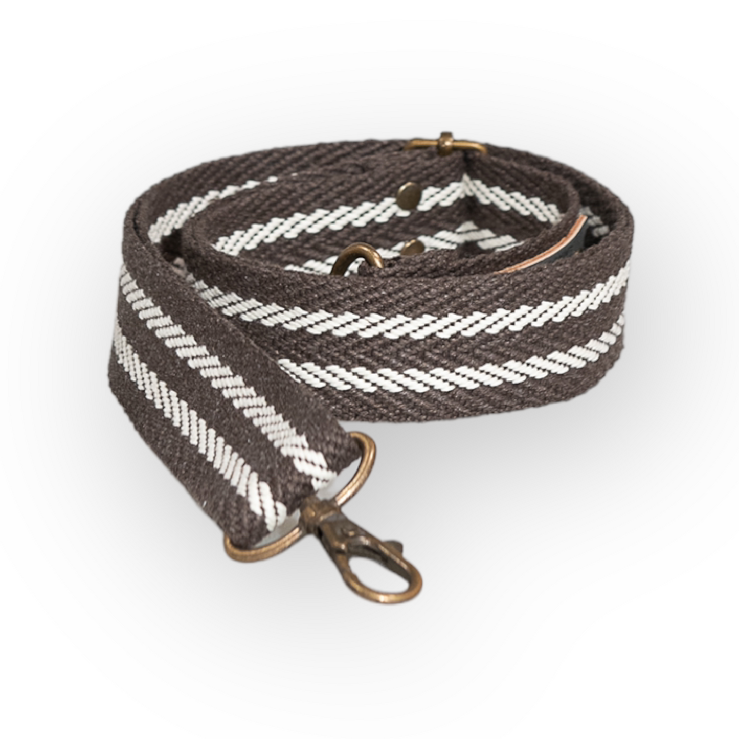 Correa bolso algodón marrón con 2 rayas negras. Combina tu bolso con diferentes correas hechas a mano para darle personalidad a tu riñonera o bolso. Las asas están realizadas de algodón reciclado o de piel vaquetilla y regulador y 2 mosquetones en Oro Viejo.