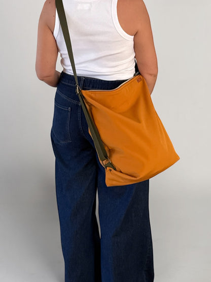 Coimbra  caramelo  Impermeable (convertible en mochila)