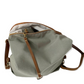 Bolso hecho a mano convertible en Mochila, modelo Coimbra color verde realizado en loneta con asas de cuero regulables para llevar como tote bag, bandolera o mochila. Forro y bolsillo interior. Llaeveo de piel interior de regalo
