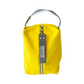 Neceser de tejido de neopreno color Amarillo l con una práctica asa de algodón color natural que te permitirá colgar el neceser del pomo de la puerta o cualquier colgador. Están realizados mano en Barcelona y disponen de forro repelente al agua y bolsillo interior. El tirador de la cremallera se convierte en un llavero extraible.  Además puedes escoger personalizar tu neceser con 2 iniciales.
